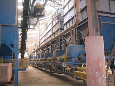Eight 150 ton capacity clay storage silos with VFD controlled belt feeders, blending clay and non-plastic products for a brick manufacturing plant.