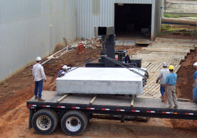Handling 28,000 lb plinths for installation in a limited access area.