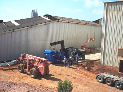 Rigging and handling of a 56,000 lb crusher for installation in an area not accessible by a crane.