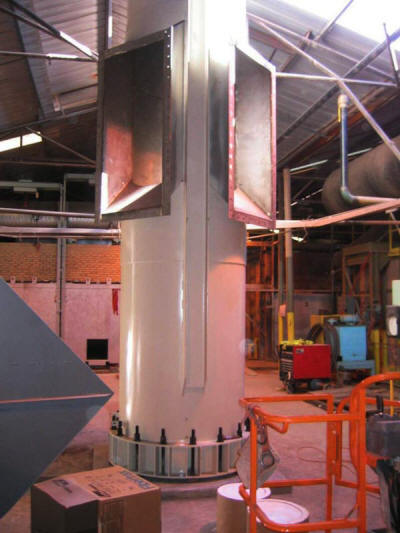 The base section of a 101' tall freestanding, double-walled, double breached exhaust stack anchored into place.