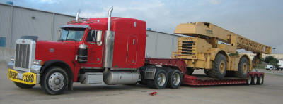 Permit over-width and overweight load with our, company owned, 51 ton capacity RGN Trailer.