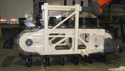 Demonstration reclaimer unit for a large cantilever half portal reclaim system or a bridge reclaim and storage system.