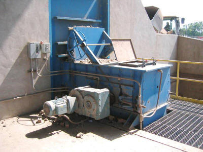 Drive unit for a stockpile reclaimer utilized in a brick plant's clay and non-plastics grinding and screening operation.