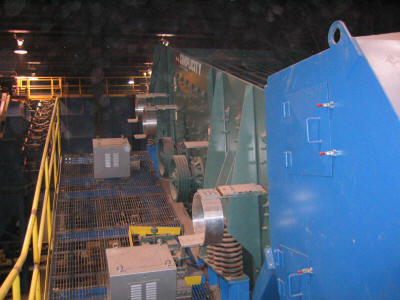 8’x16’ triple deck vibrating screen with screen heat and screen tower in a clay product grinding room at a brick plant.