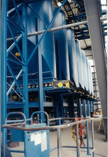 Seven 100 ton silos with belt feeders for clay and clay products