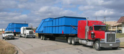 Hauling prefabricated modules for eight 150 ton capacity clay storage silos for a brick manufacturing plant.